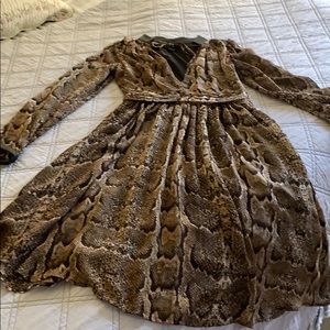 Snake print knee length dress.